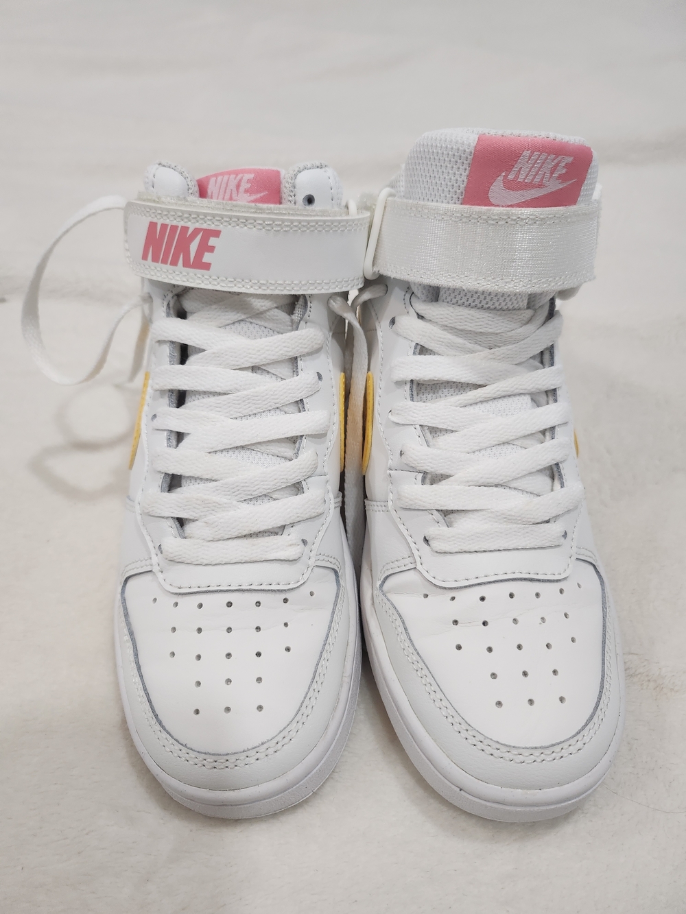 Nike White High Top Sneakers with Pink Accents